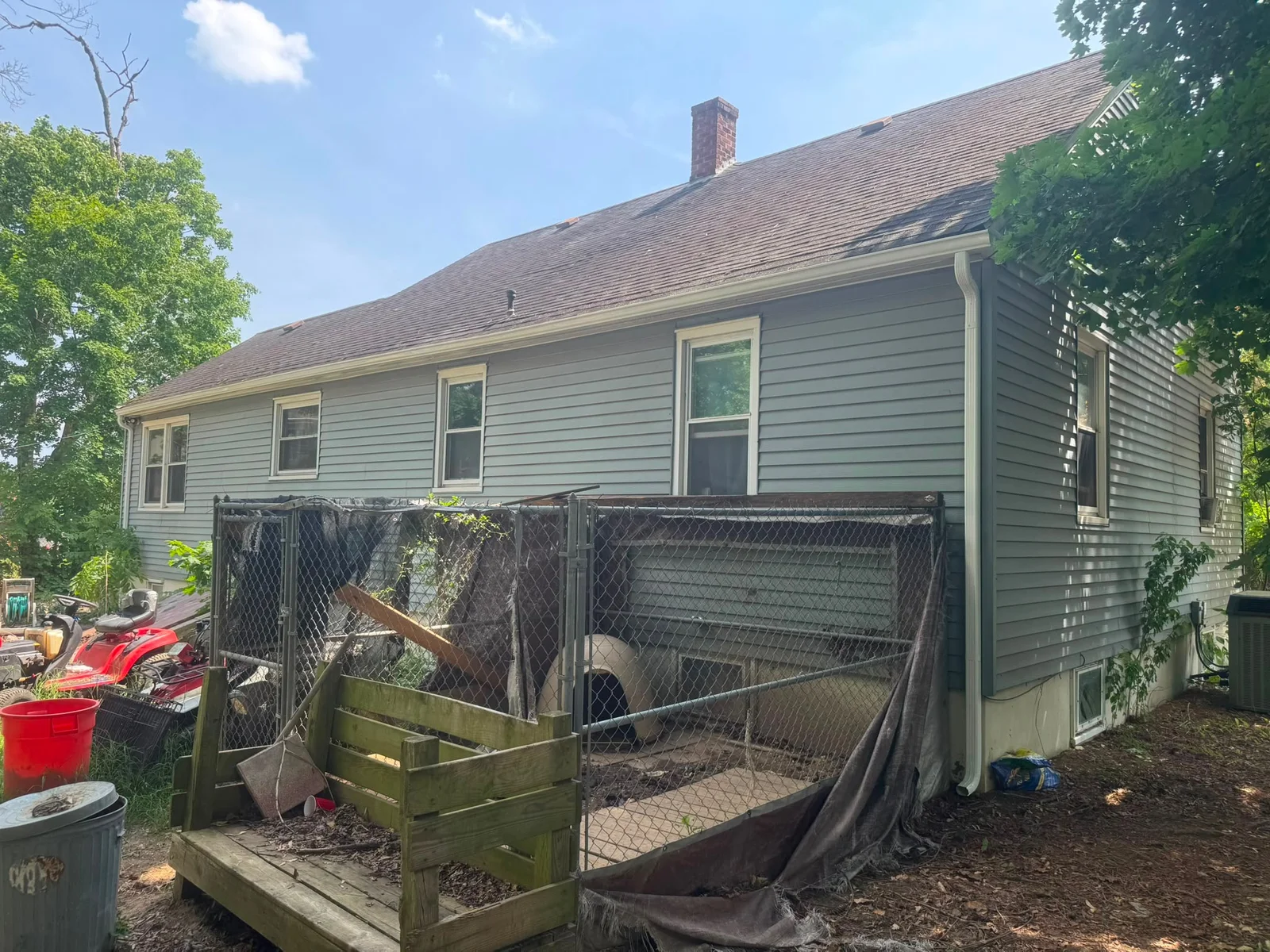 Installed gutter and downspout along the side roofline