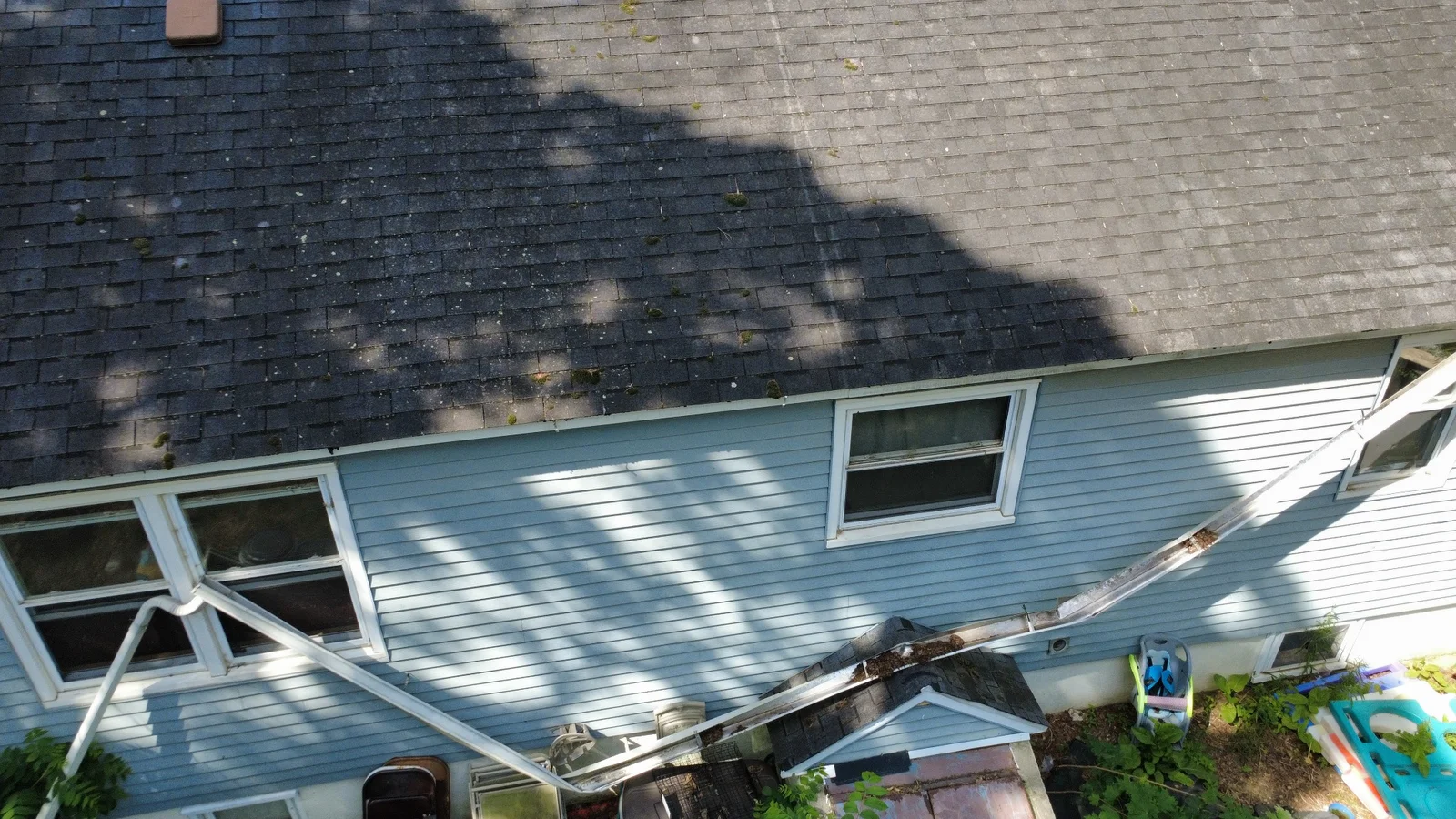 The original damaged gutter during inspection