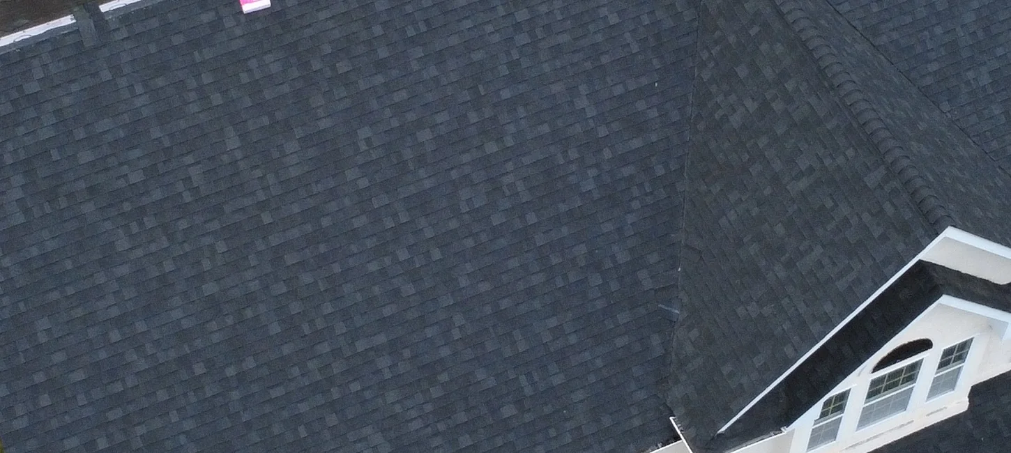 Shingled roof-plane detail during installation