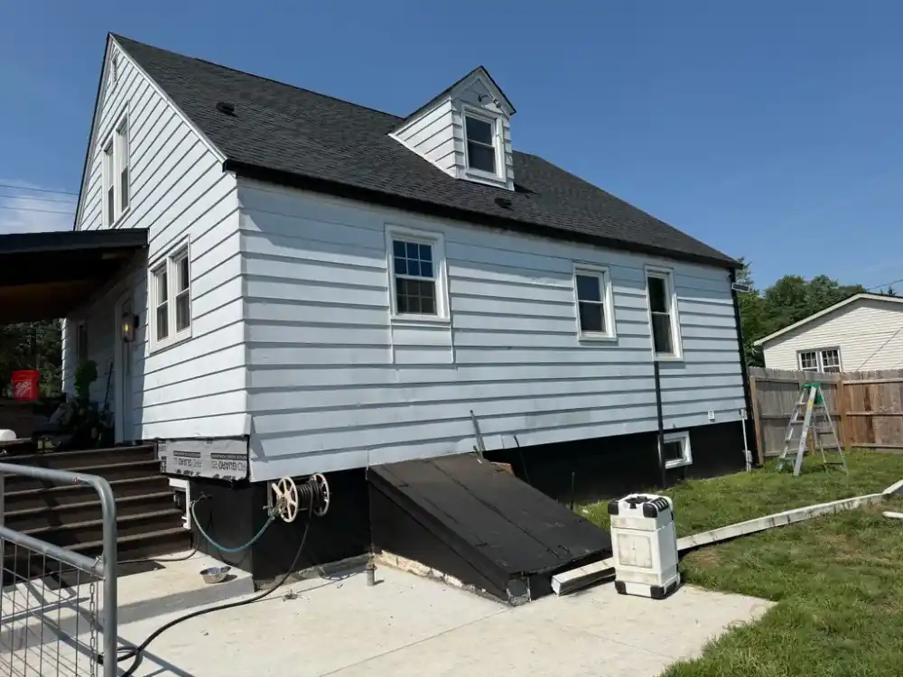 Black gutter and downspout along the side roofline