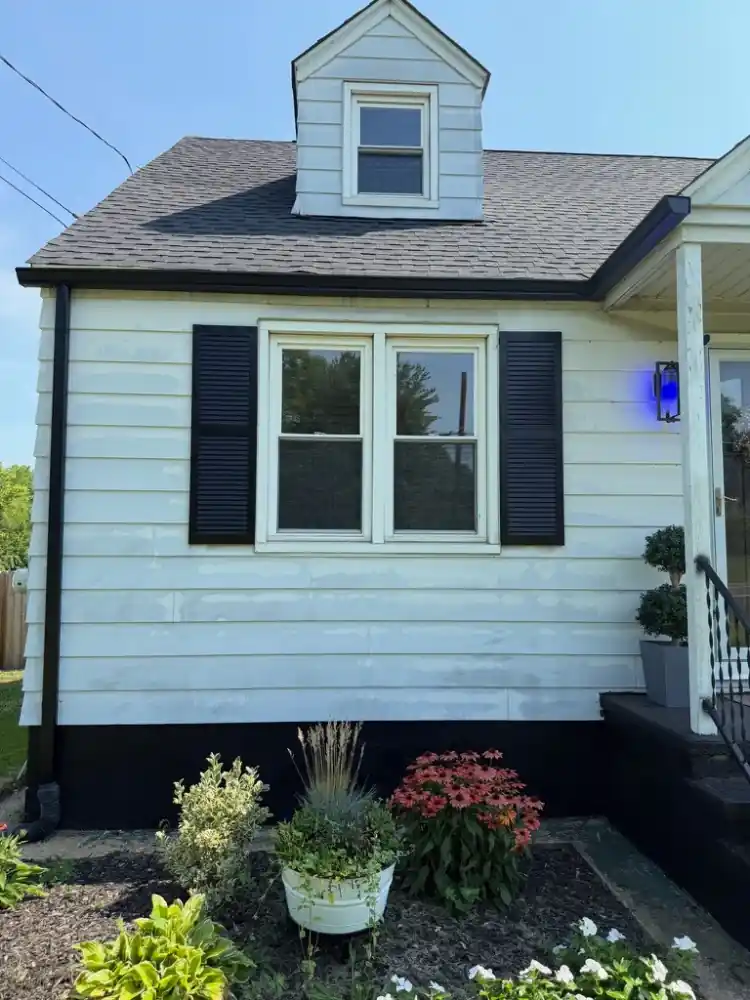 Black front gutter and downspout detail