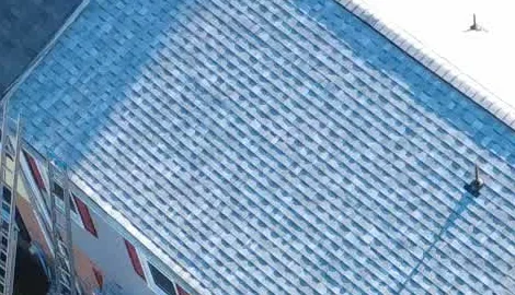 Installed architectural-shingle detail from the wider aerial
