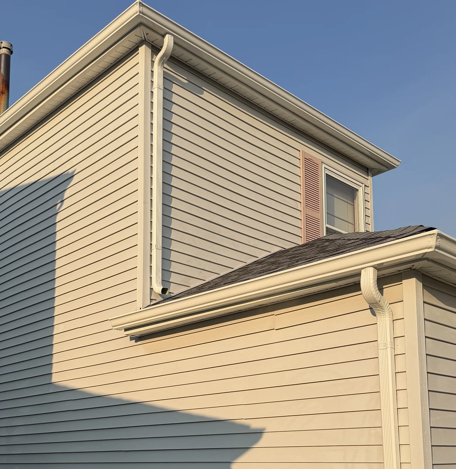 Side eave, bay roof and downspout detail