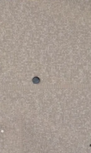 Installed shingle roof and vent in the matched video frame