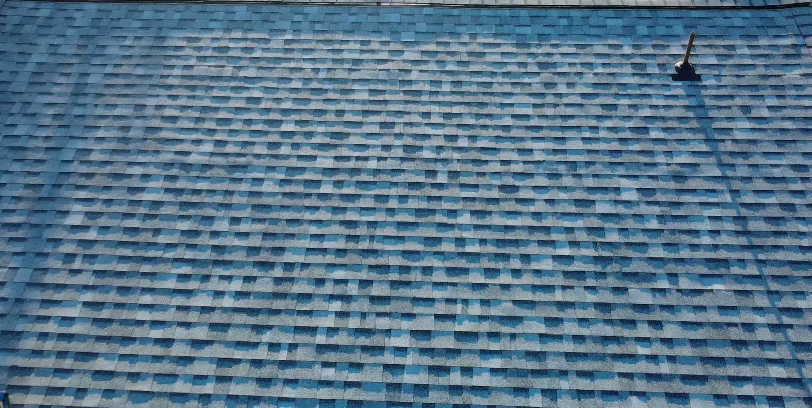 Installed architectural shingles and ridge detail