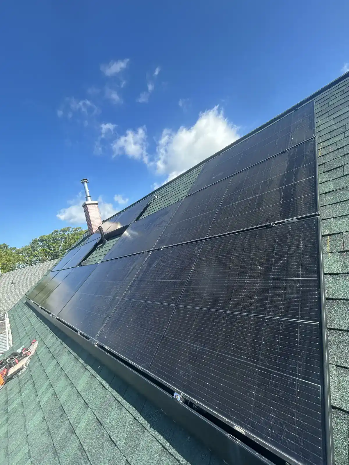Dark solar panel rows stepping around an open area in Iselin, New Jersey