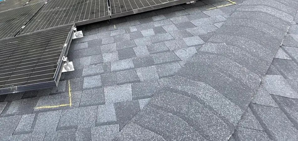 Offset solar panel sections and visible mounting hardware in Jackson Township, New Jersey