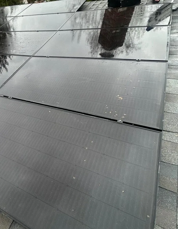 Dark solar panel faces arranged in broad rows in Laurel Springs, New Jersey