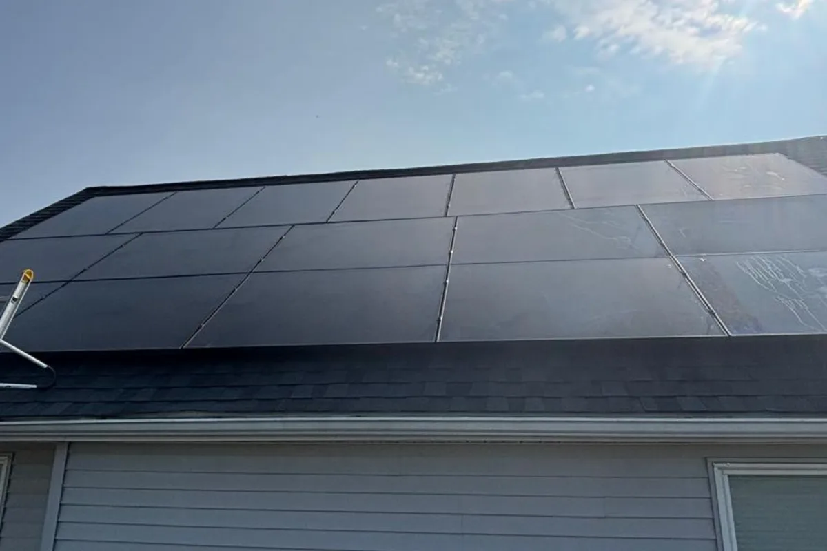 Wide view of dark solar panels in horizontal rows in Pine Grove, Pennsylvania
