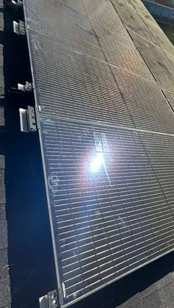 Dark solar modules and silver mounting clips in Williamstown, New Jersey
