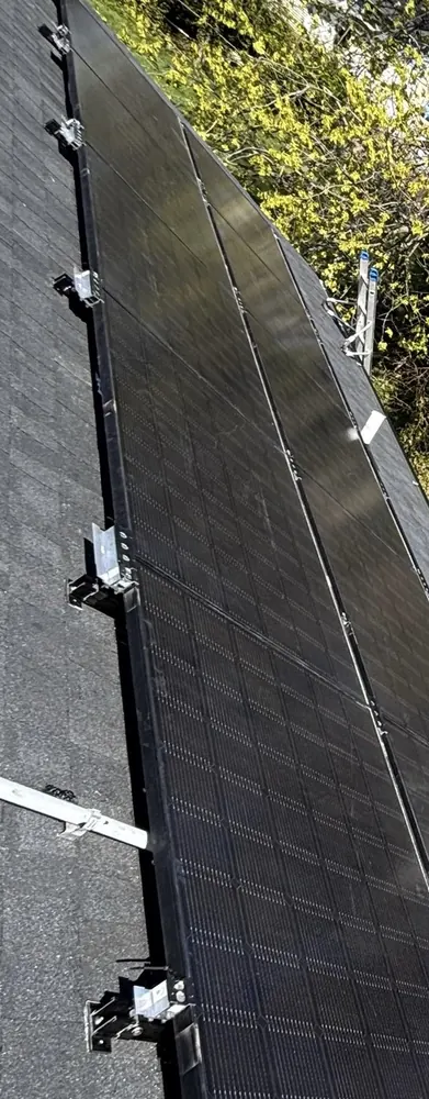 Side view of dark solar modules and exposed support hardware in Willingboro, New Jersey
