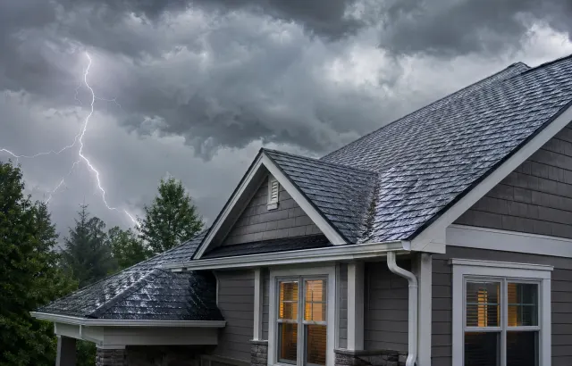Storm clouds over a roof for storm damage inspection service